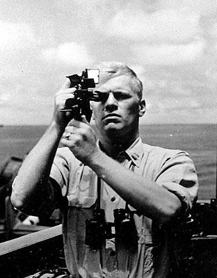 AV82-216A. Navigation Officer Gerald R. Ford takes a sextant reading aboard the USS Monterey. 1944