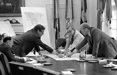 B0252-05A - CIA Director George Bush discusses the evacuation of Americans from Beirut with President Ford during a meeting in the Cabinet Room. June 17, 1976.