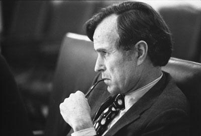 B0255-02A. CIA Director George H.W. Bush listens intently at a meeting discussing the situation in Lebanon.  June 17, 1976.