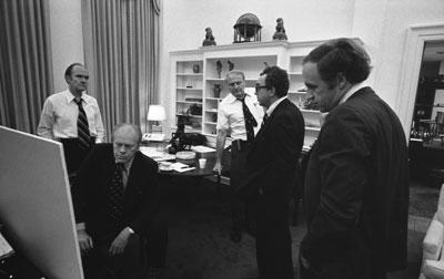 B0281-33. President Ford monitors the evacuation of American citizens from Beirut from the office of National Security Adviser Brent Scowcroft in the early morning hours of June 19.  June 19, 1976.  