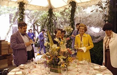 B0560-06. First Lady Betty Ford observes the table settings and staff preparations for the evening's state dinner in honor of Queen Elizabeth II of England and Prince Philip.  July 7, 1976. 