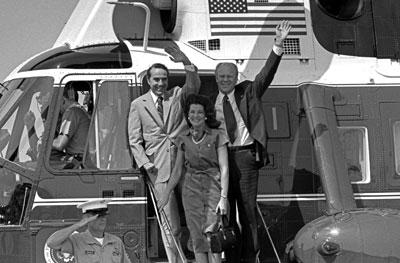 B1259-05. President Ford, vice presidential running mate Senator Robert Dole and Mrs. Elizabeth Dole debark Marine I to attend a campaign rally in the Senator’s hometown.  Russell, Kansas.   August 20, 1976.