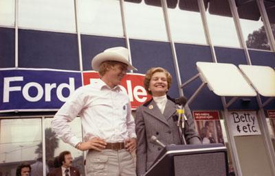 B1963-21A. First Lady Betty Ford introduces her son Steve to a crowd gathered outside a President Ford Committee phone bank in Downey, California.  October 19, 1976.  