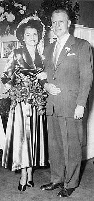 H0013-04. Gerald R. Ford, Jr., and Betty Ford pose in front of the ambo in Grace Episcopal Church in Grand Rapids, MI, following their marriage. October 15, 1948