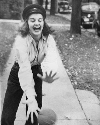 H0015-1. Betty playing ball at a house party for her sorority "The Good Cheers." Ottawa Beach, Michigan. 1934.