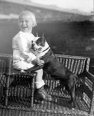 H0027-03. Gerald Ford with his pet Boston Terrier. Different sources identify the dog as either Spot or Fleck. ca. 1916