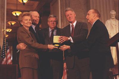 P76975-28. President Ford and First Lady Betty Ford receive the Congressional Gold Medal from Speaker of the House Dennis Hastert and Senator Strom Thurmond.  Also shown is President Bill Clinton.  October 27, 1999. 