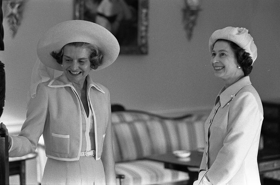 B0545-04A. First Lady Betty Ford and Queen Elizabeth II view the Queen's Bedroom during a tour of the White House.  July 7, 1976.