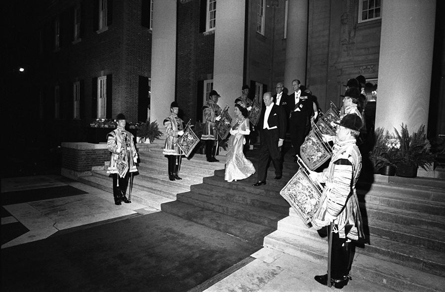 B0602-05A. Queen Elizabeth II, President Ford, Prince Philip, and others entering the garden at the British Embassy in Washington, DC for a reciprocal state dinner hosted by the Queen.  July 8, 1976. 