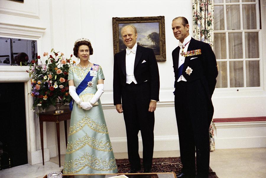 B0604-10A. Queen Elizabeth II, President Ford, and Prince Philip at the British Embassy in Washington, DC for a reciprocal state dinner hosted by the Queen.  July 8, 1976. 
