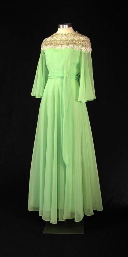 Green gown with lace shoulders