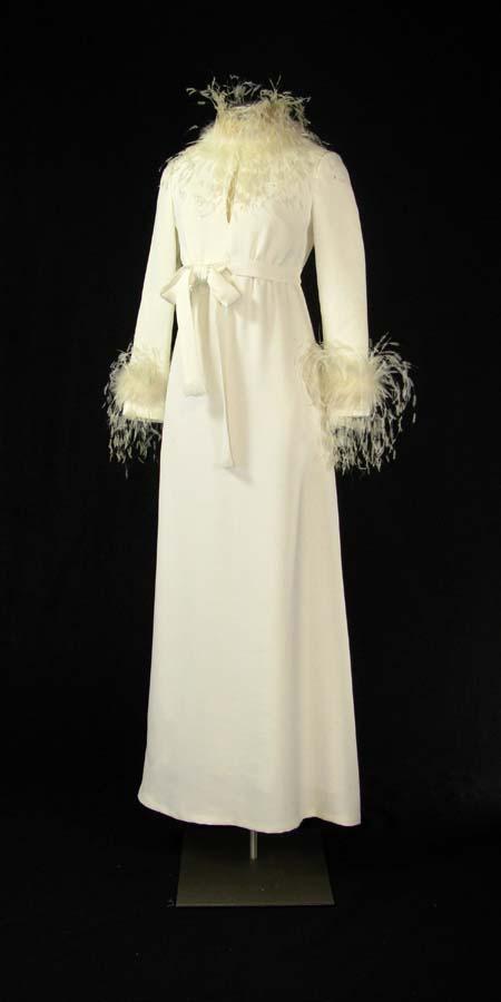 White gown with ostrich feather cuffs