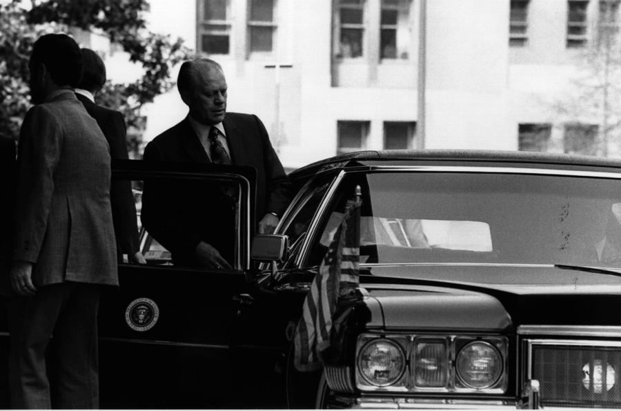 A4228-35A. President Ford enters the limousine upon on his departure from Constitution Hall after he addressed the 63rd Annual Meeting of the U.S. Chamber of Commerce. April 28, 1975.