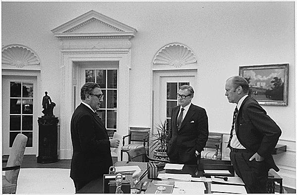 A4241-30A. President Ford meets in the Oval Office with Secretary of State Henry Kissinger and Vice President Nelson A. Rockefeller to discuss the American evacuation of Saigon, April 28, 1975.