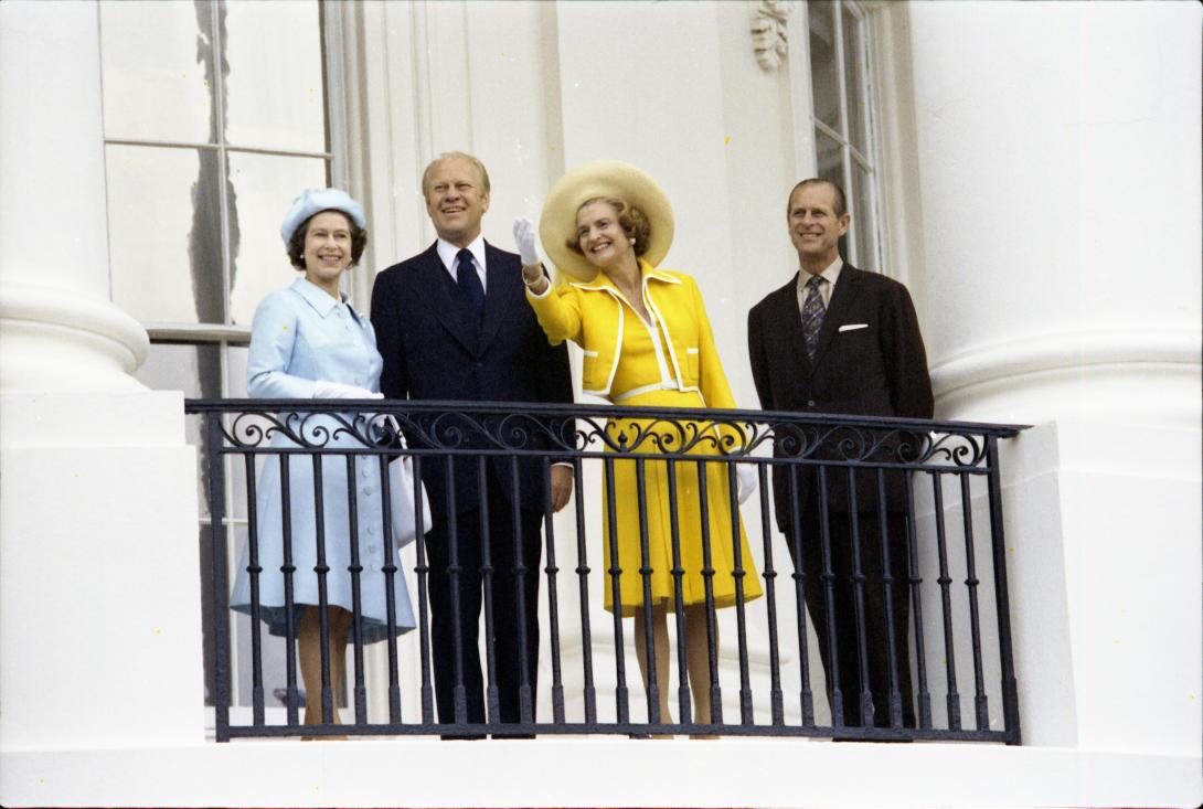 B0549-30. President and Mrs. Ford and Her Majesty Queen Elizabeth II and Prince Philip on the Truman Balcony following the Queen's state arrival at the White House.  July 7, 1976.