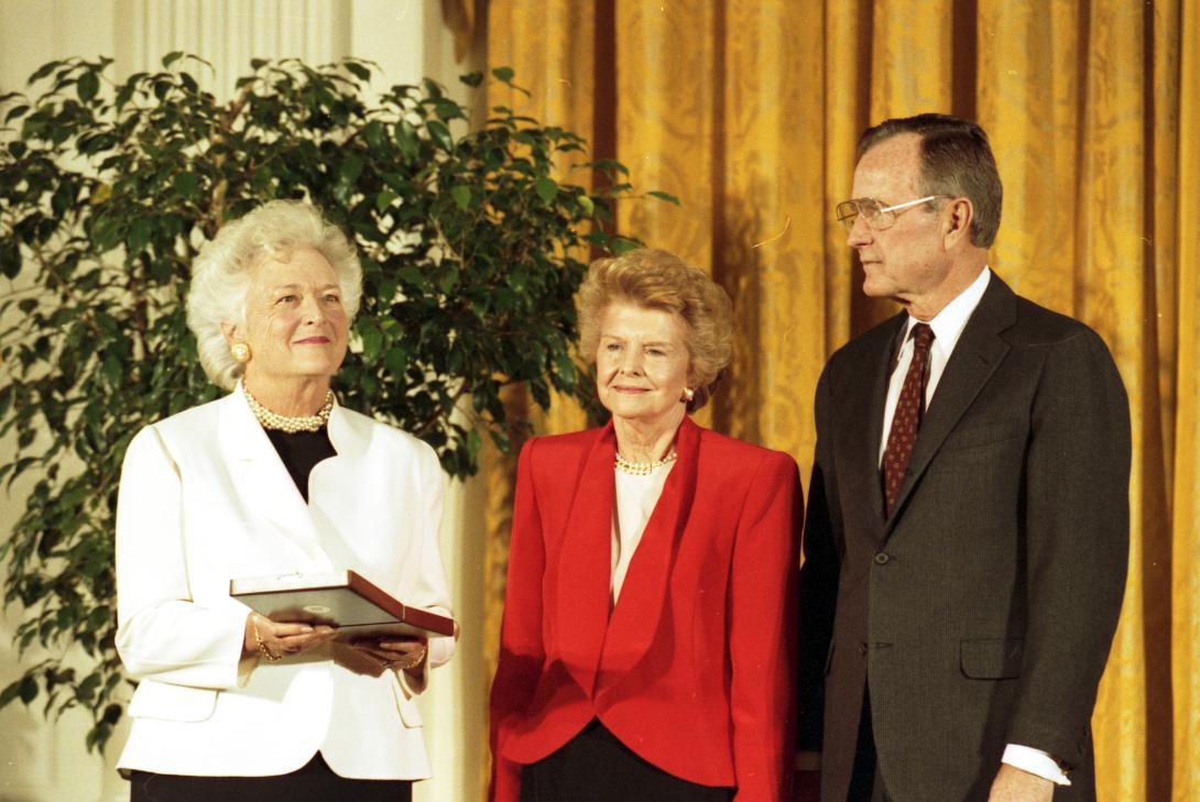 P26484-17. Former First Lady Betty Ford receives the Presidential Medal of Freedom from President George H.W. Bush and First Lady Barbara Bush. November 18, 1991.