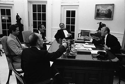 A4549-21A. President Ford and senior staff members react to the news of the recapture of the S.S. Mayaguez and its crew.  May 14, 1975.