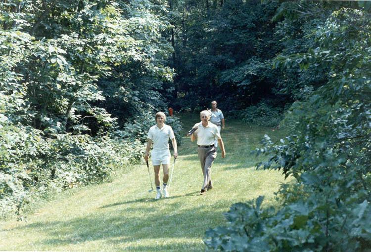 A5174-30A. President Ford playing golf with Mike Ford at Camp David. June 22, 1975.