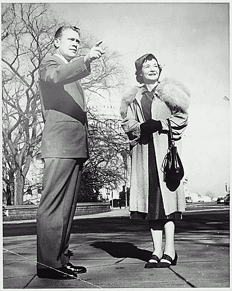H0010-4. Representative Gerald R. Ford, Jr., points out a sight to Personal Secretary Mildred Leonard in Washington, DC. 1953.