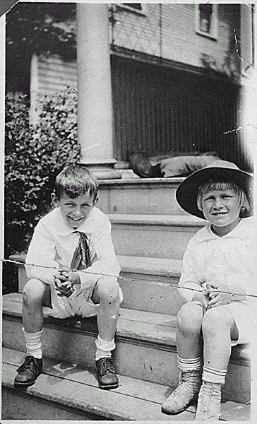 H0020-3. Gerald R. Ford, Jr. and his cousin Gardner James sit on the steps of an unidentified house. 1919.