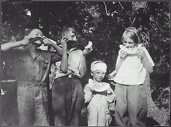 H0023-2. Gerald R. Ford, Jr., his half-brother Tom Ford and cousins Gardner and Adele James enjoy some watermelon. 1922.