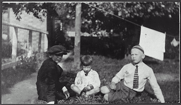 H0025-1. Gerald R. Ford, Jr. sits on the lawn with Tom Ford and their cousin Gardner James. 1923.