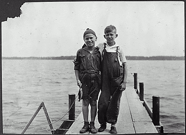 H0028-3. Gerald R. Ford, Jr. and his cousin Gardner James display the day's catch from a dock, Delavan Lake, WI. 1923