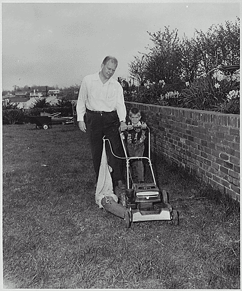 H0042-2. Gerald R. Ford, Jr., and Steven Ford cut the lawn in the back yard of the Ford residence at 514 Crown View Drive, Alexandria, VA. 1960.