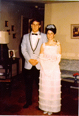 H0072-11. Mike Ford poses with his prom date in the living room of the family residence at 514 Crown View Drive, Alexandria, VA. 1968.